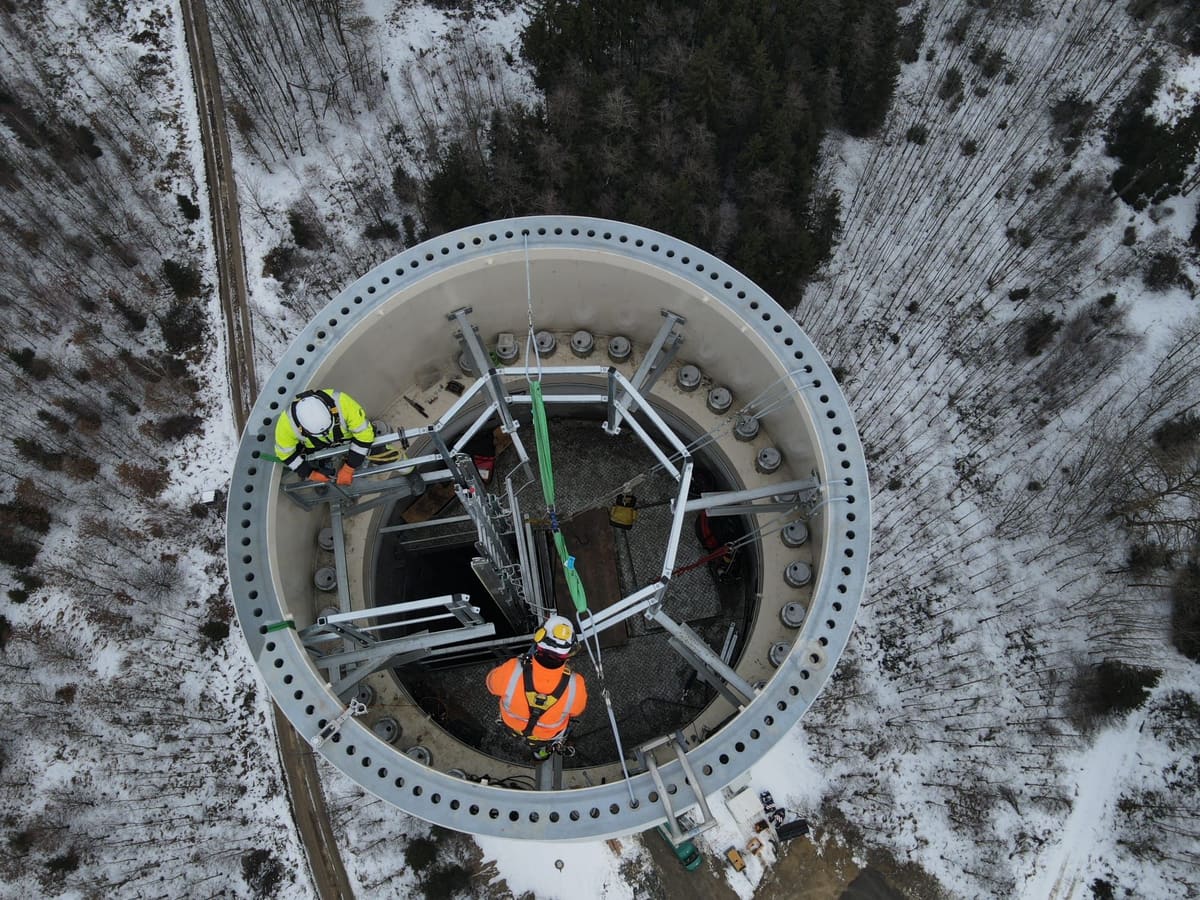 Aerial drone view of a tower top during installation